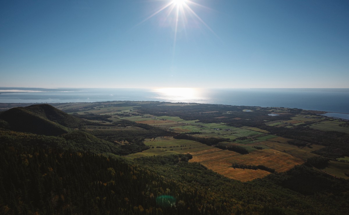 We spot last night's campsite from atop Mont-St-Joseph. Much to our surprise, it's located on a sandbar! (upper centre)